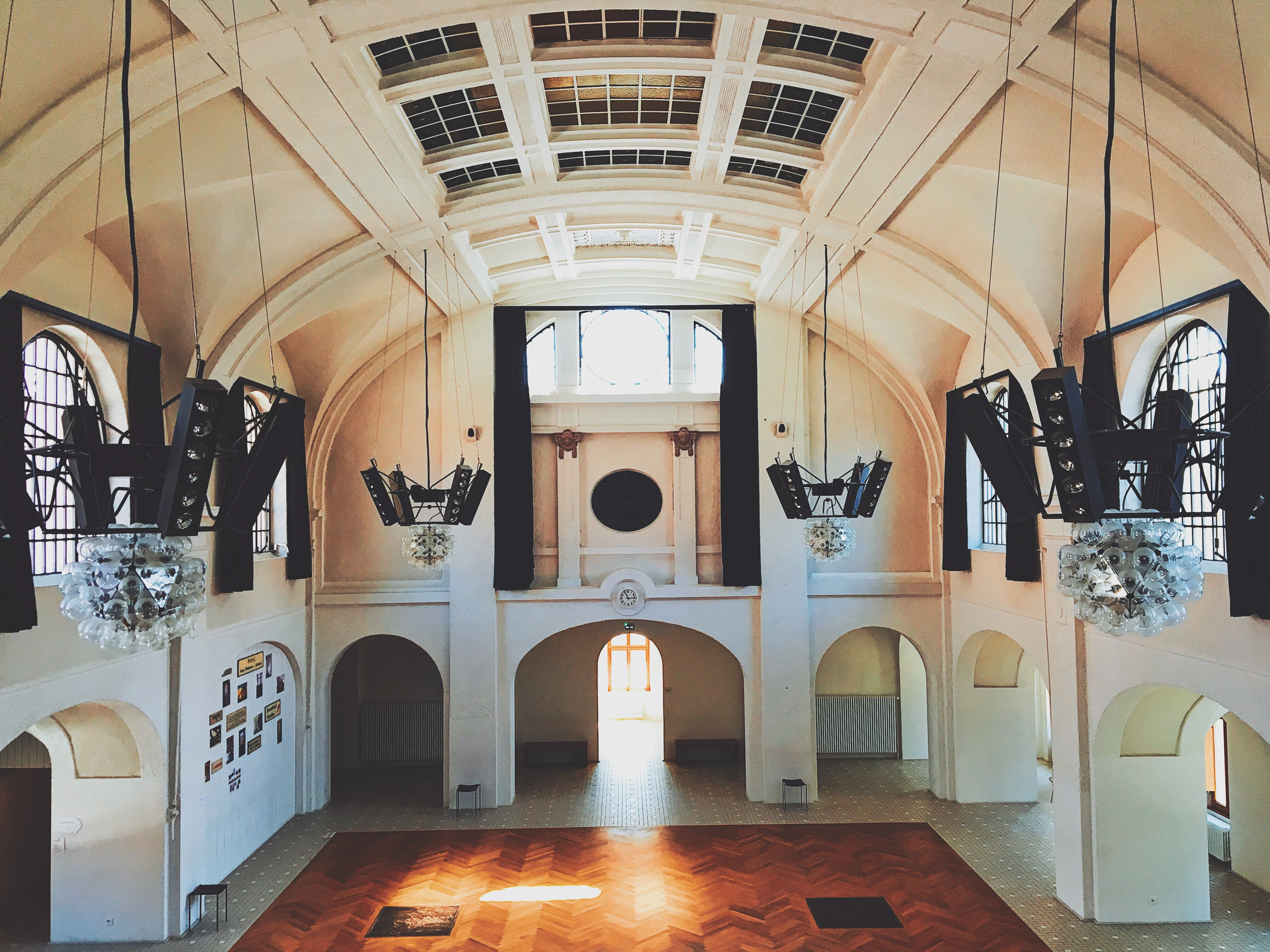 A large room with high ceilings and high windows