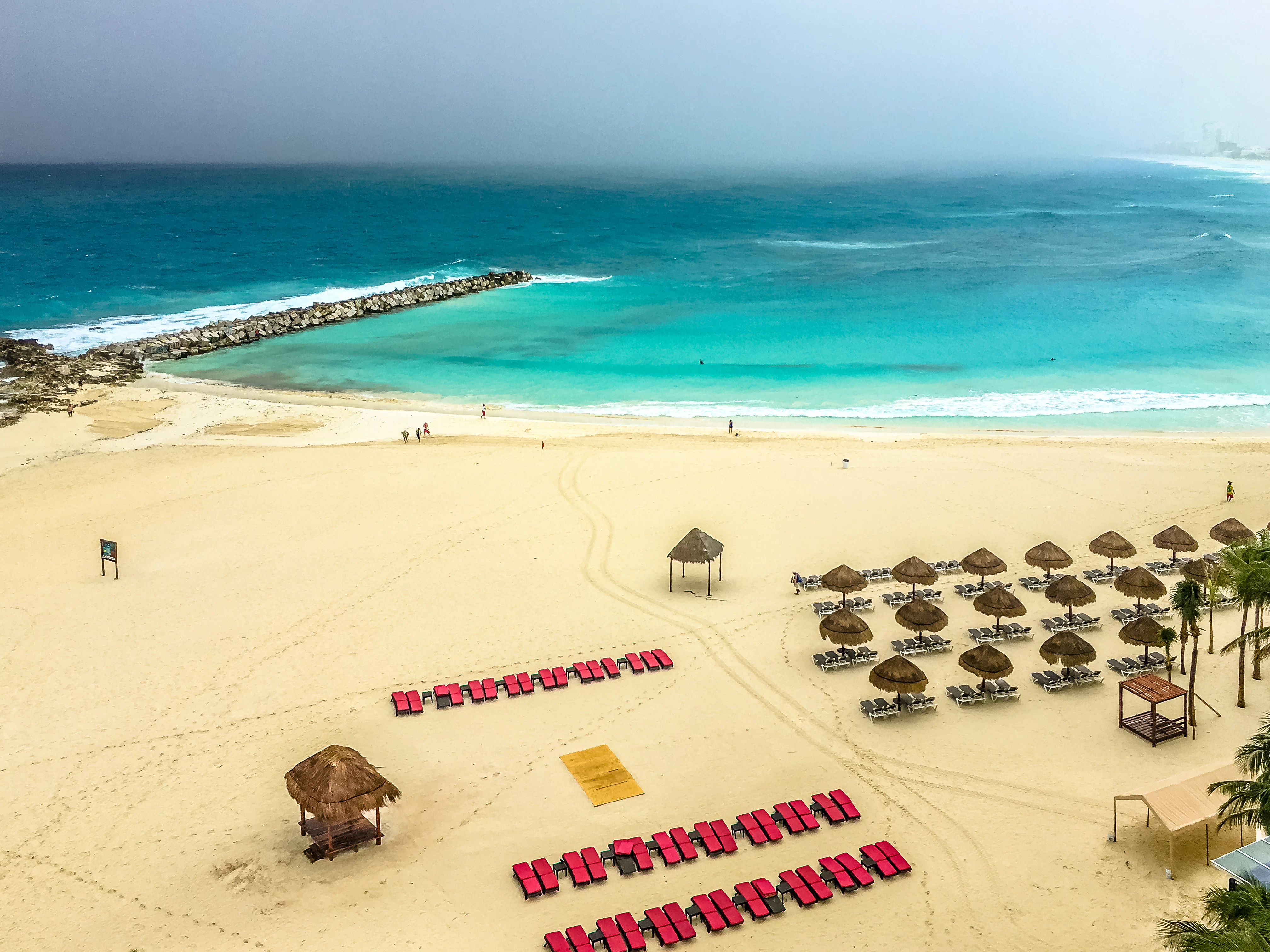 white sand beside water during daytime