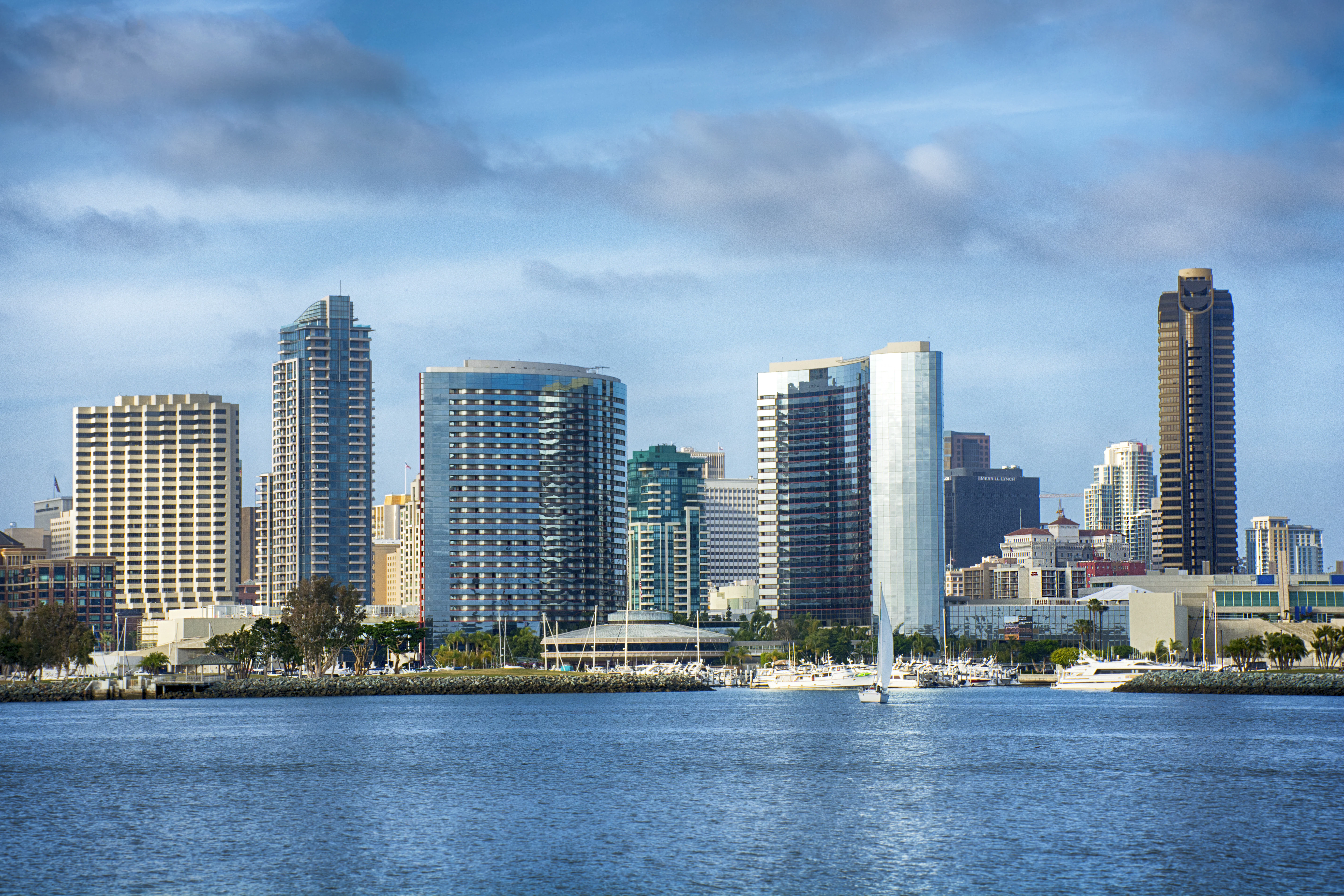 City skyline with boats on the water.