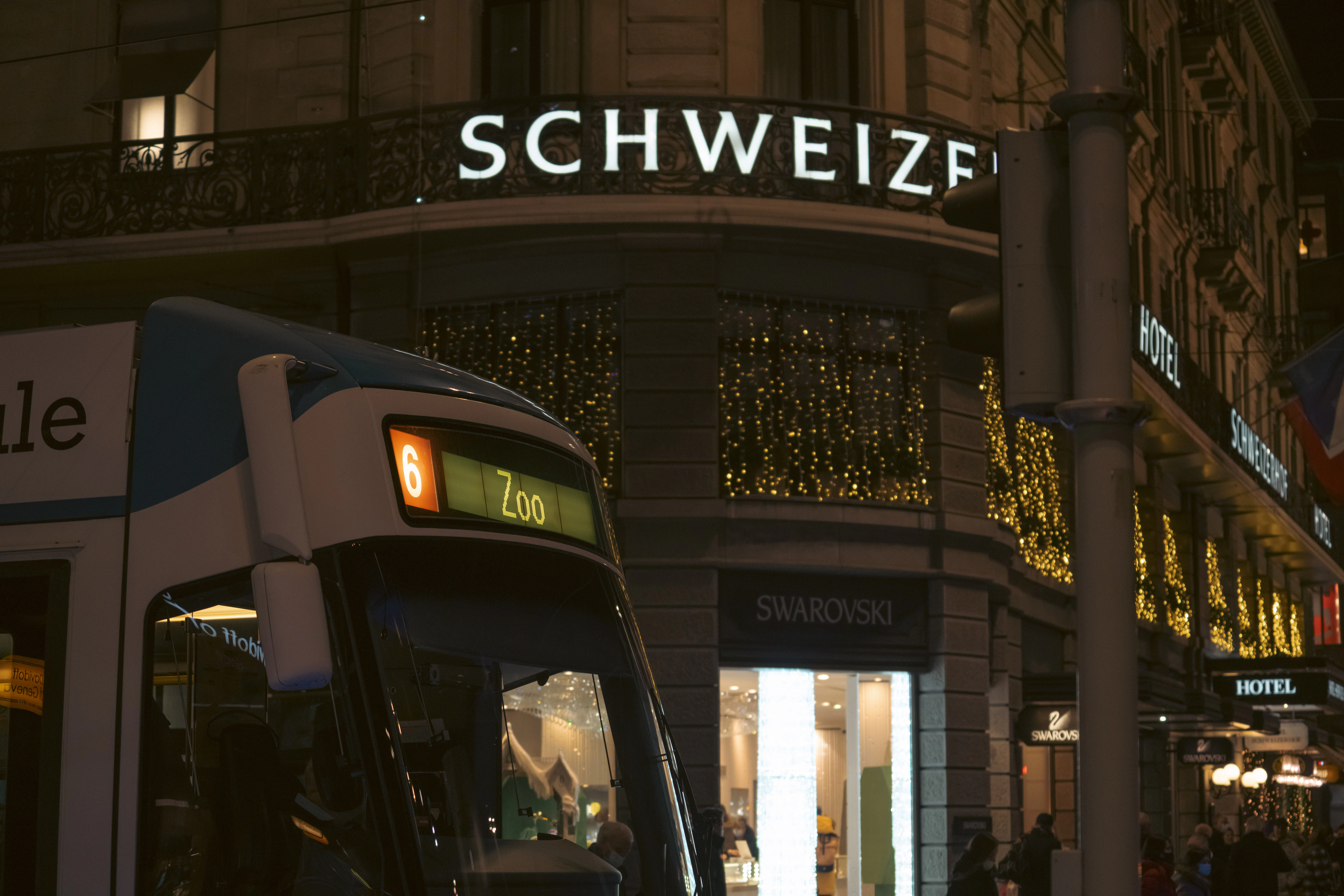 a city bus parked in front of a building