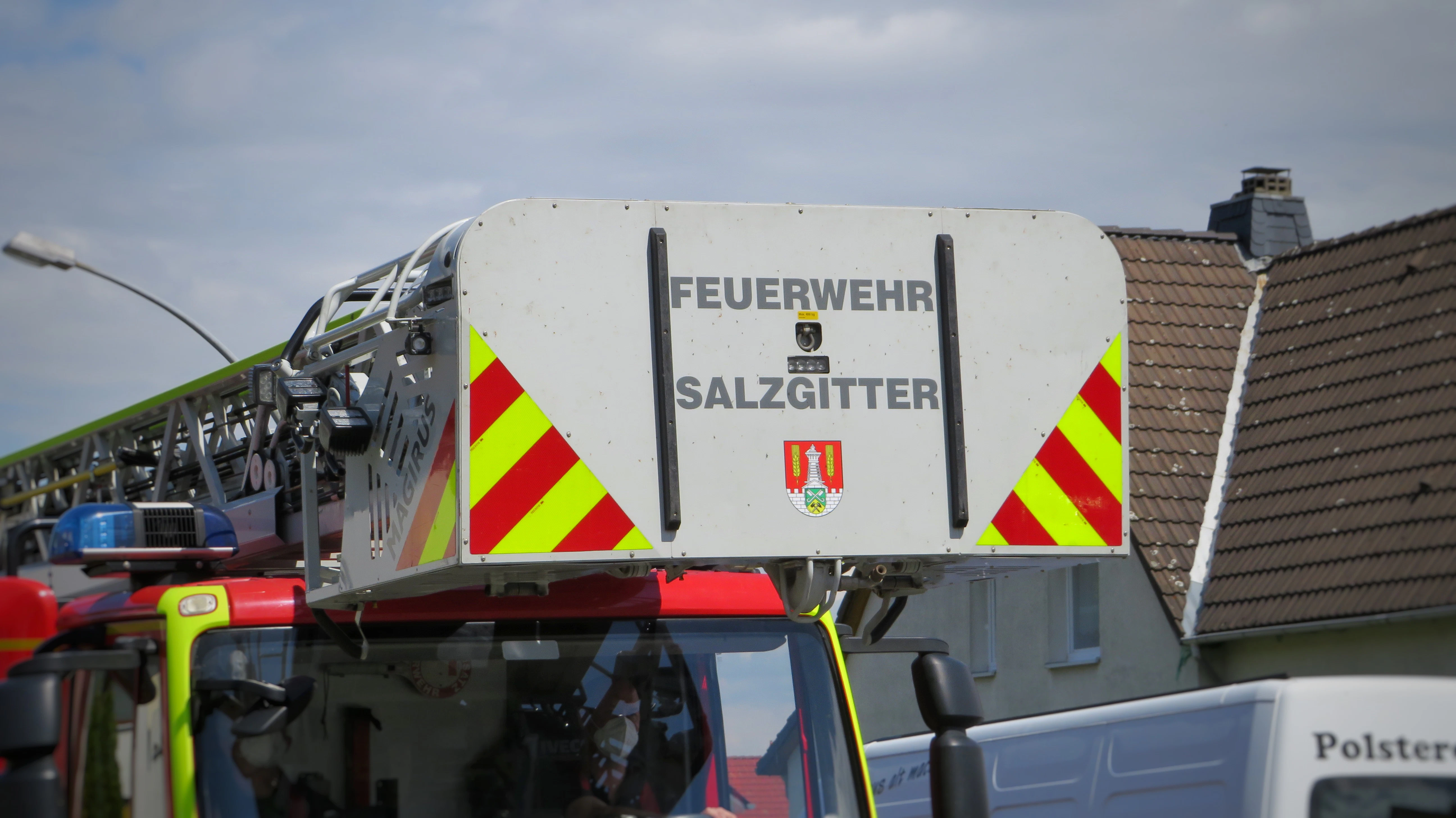 a fire truck is parked in front of a house