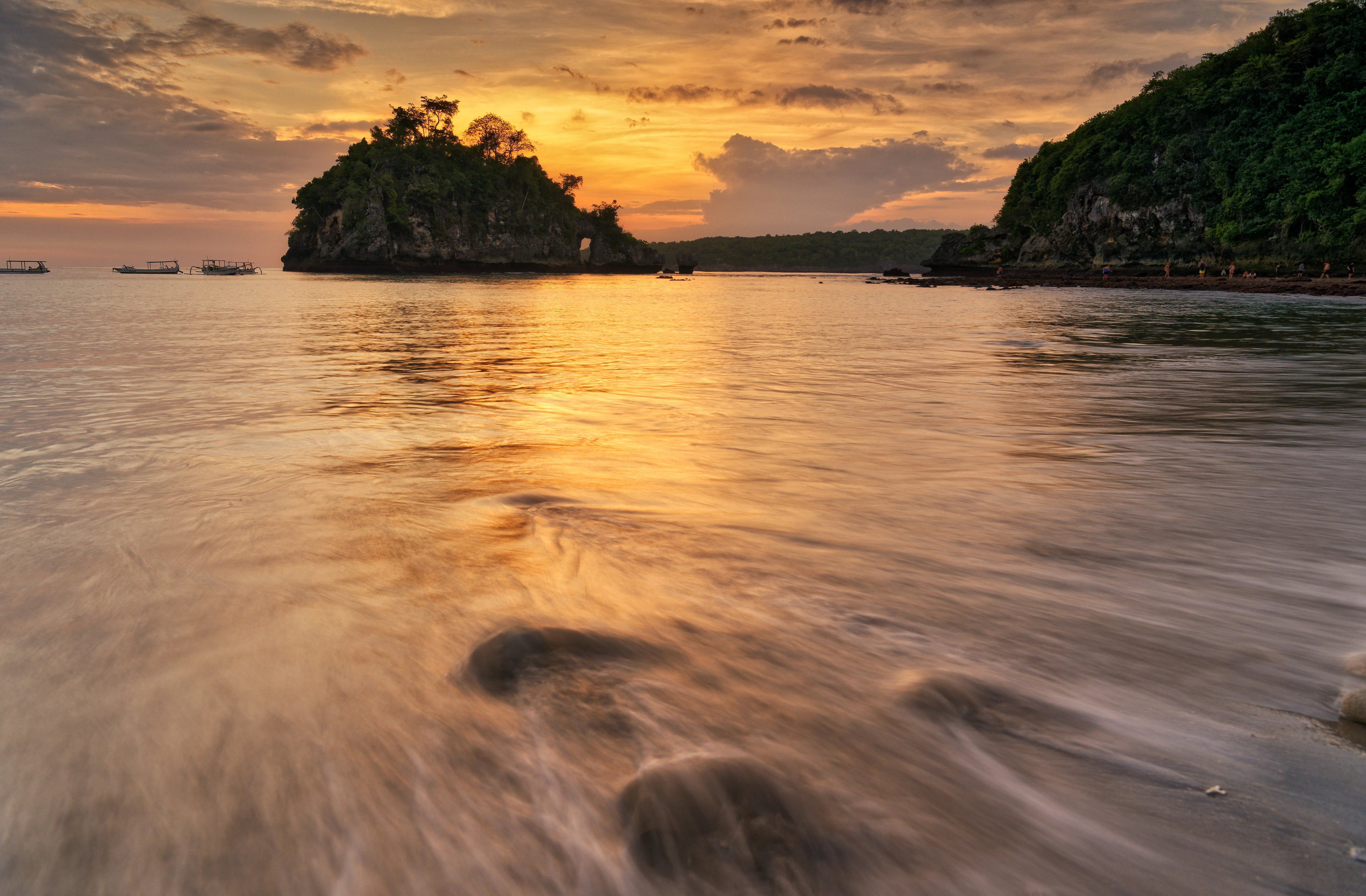 A body of water with a small island in the background