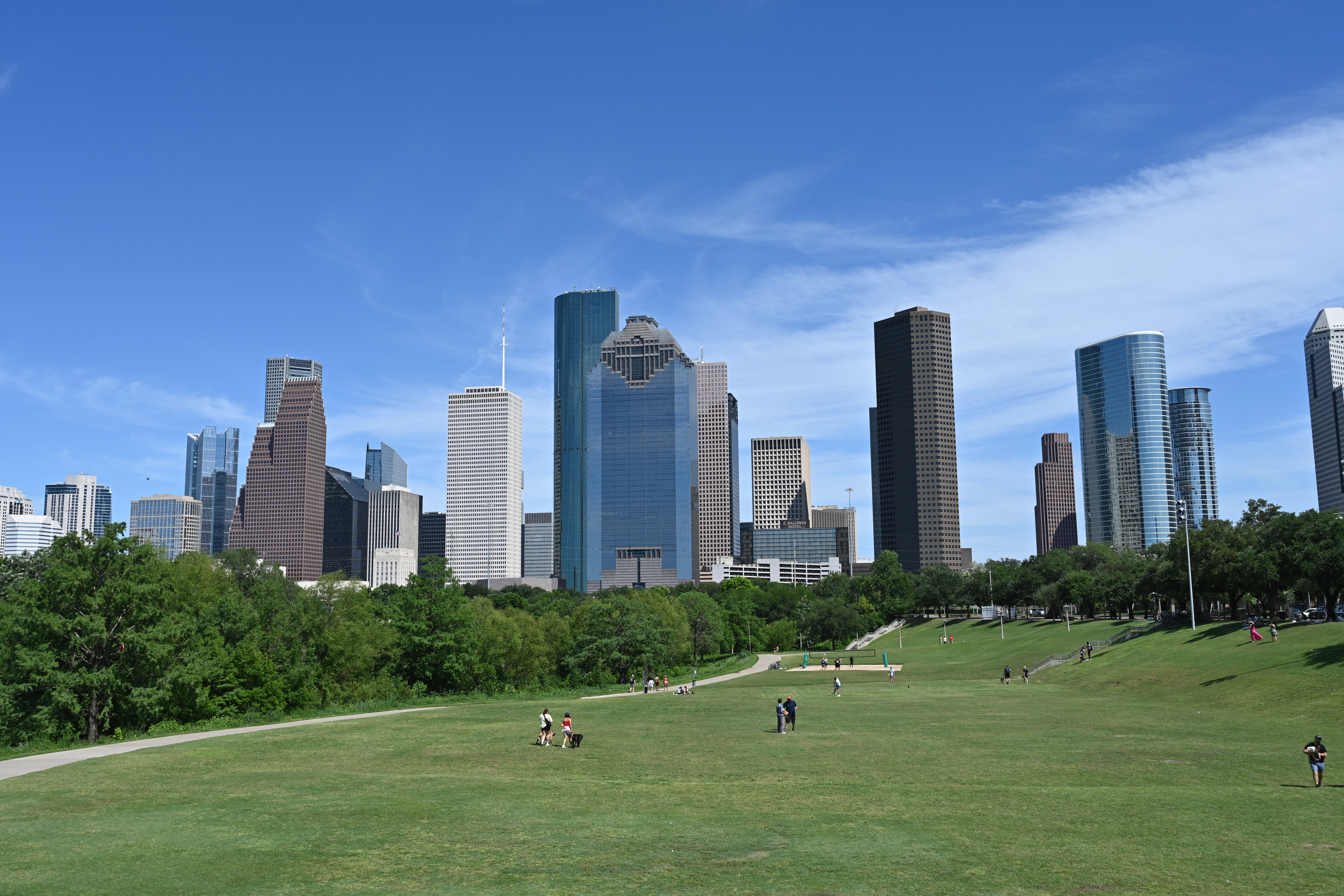 Houston, texas skyline is visible on a sunny day.