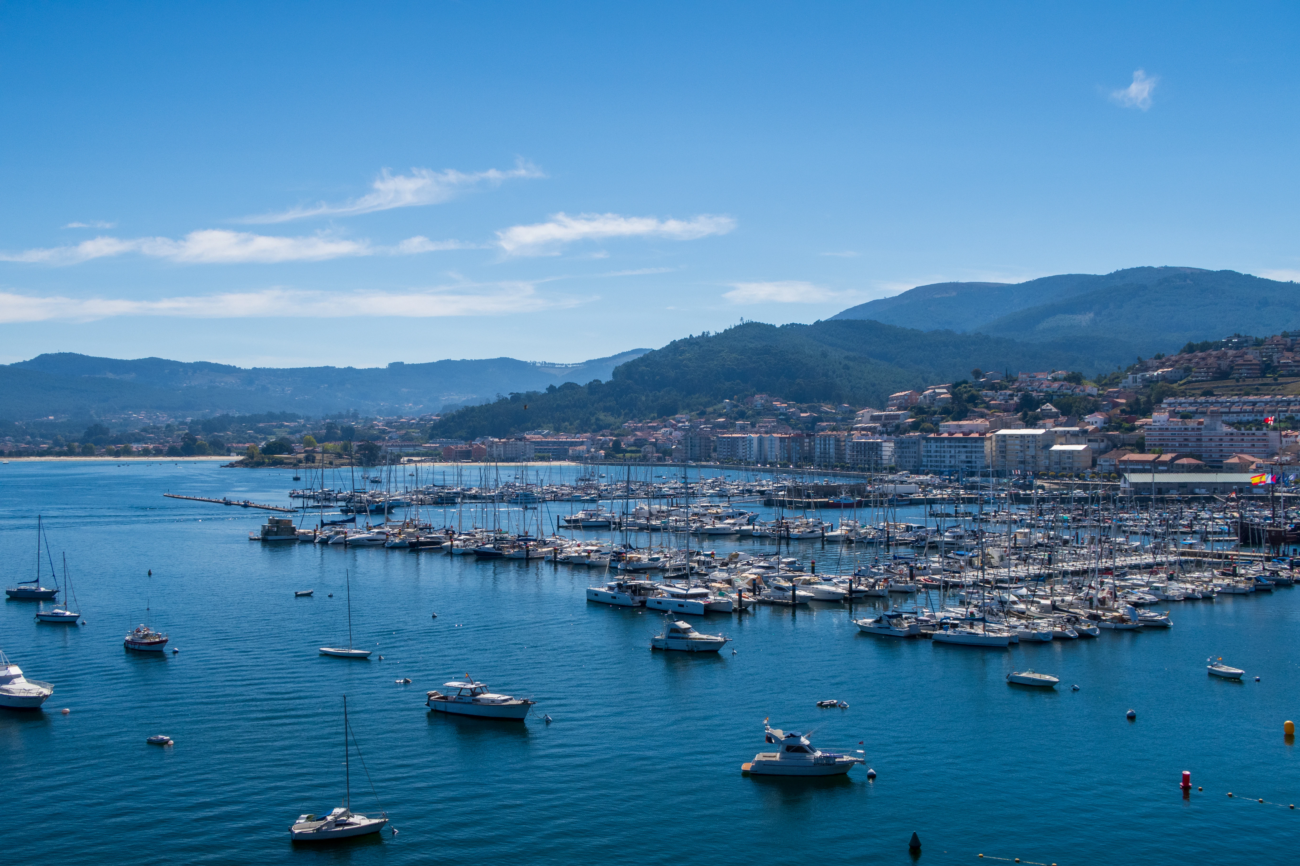 A large body of water filled with lots of boats