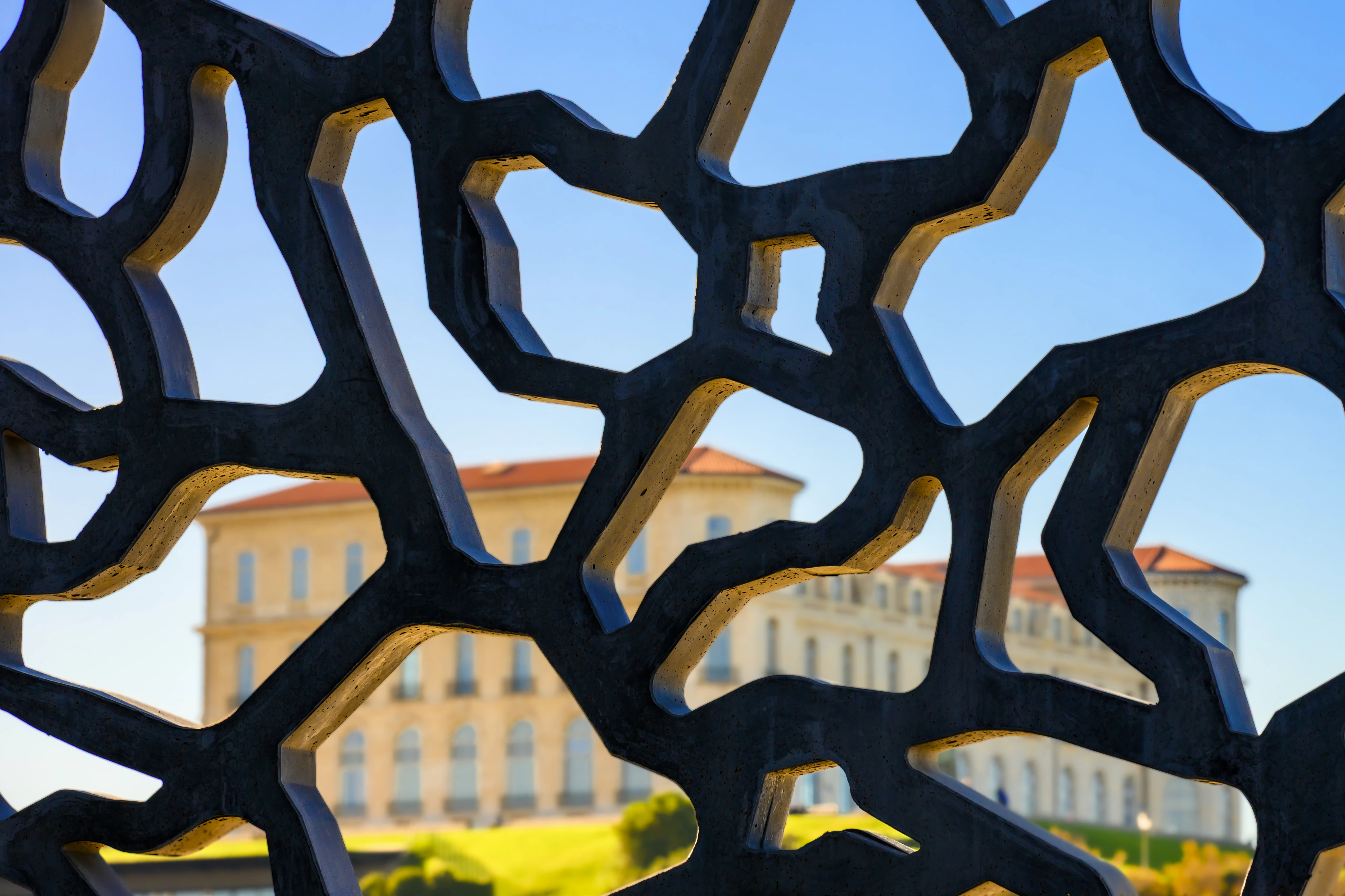 Building seen through abstract metal structure