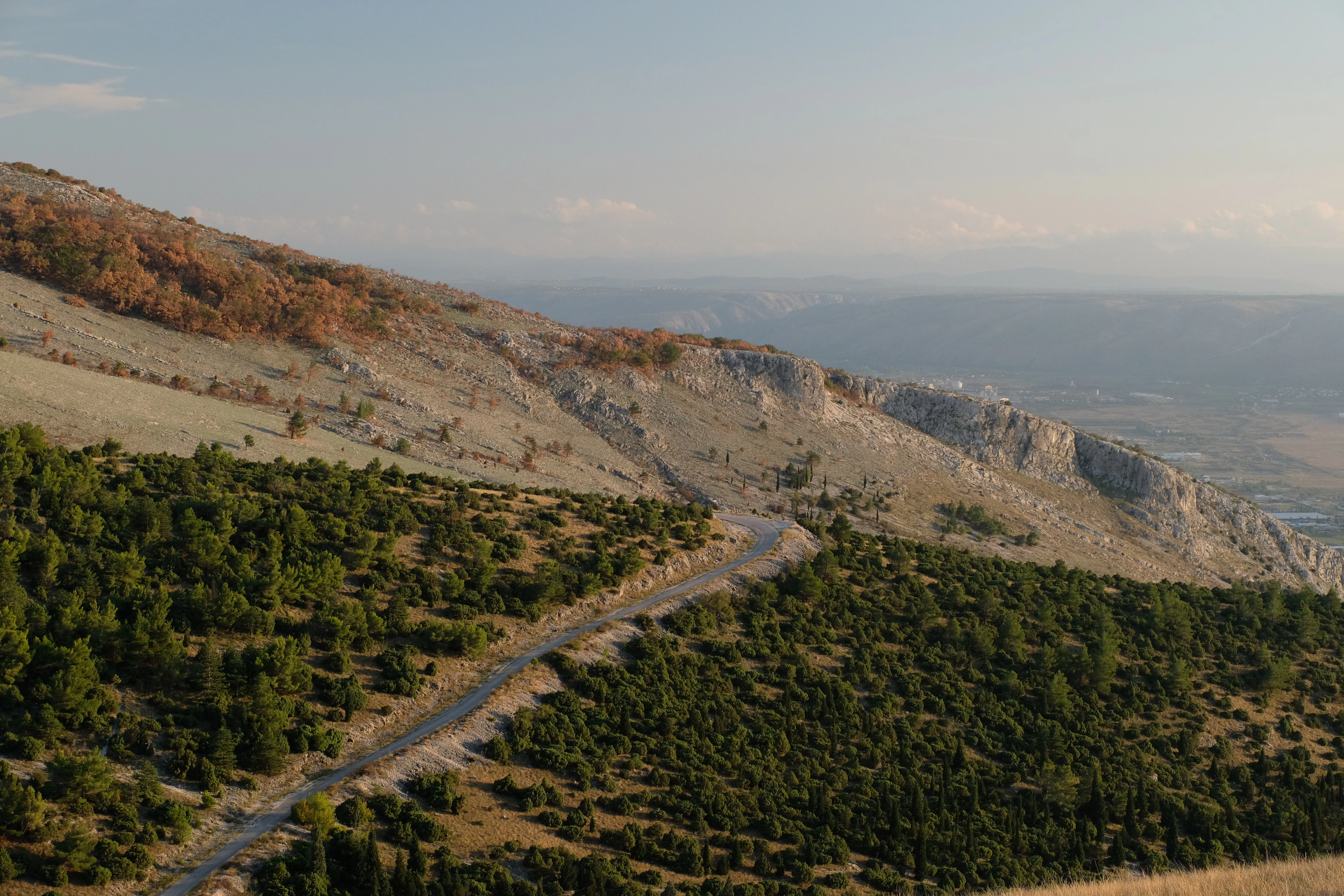 A winding road through a mountainous landscape