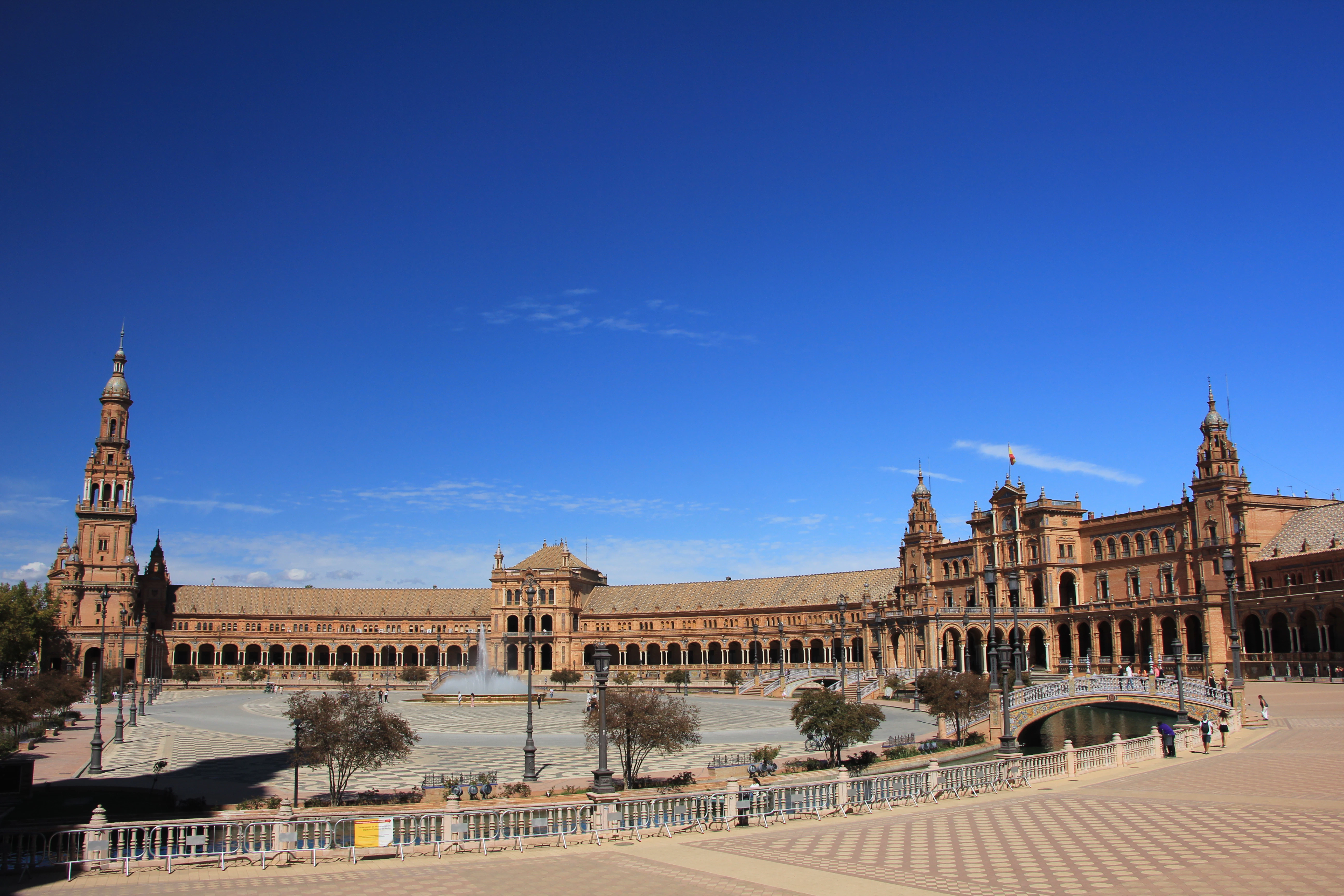 A large building with a clock tower in the middle of it