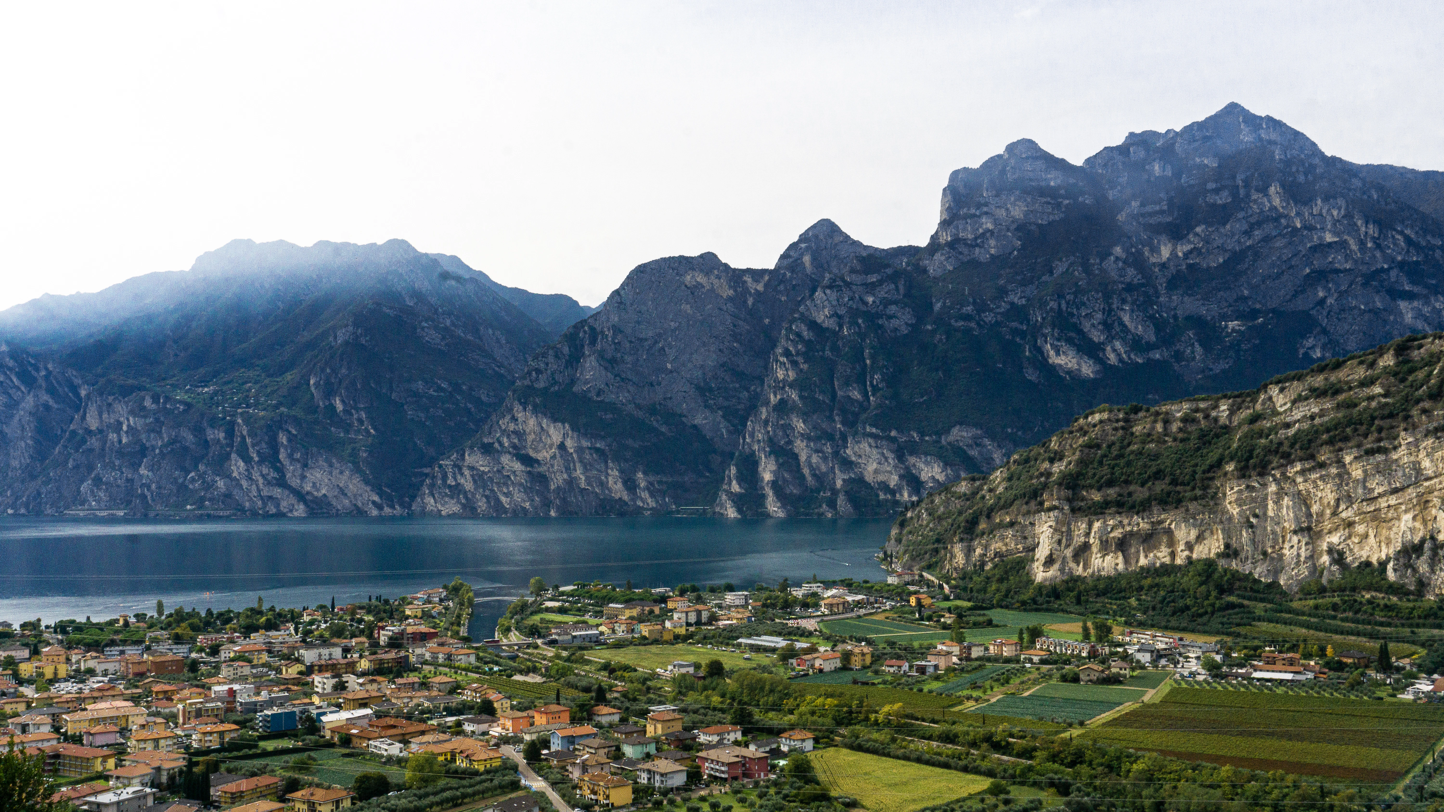 a town by a lake and mountains