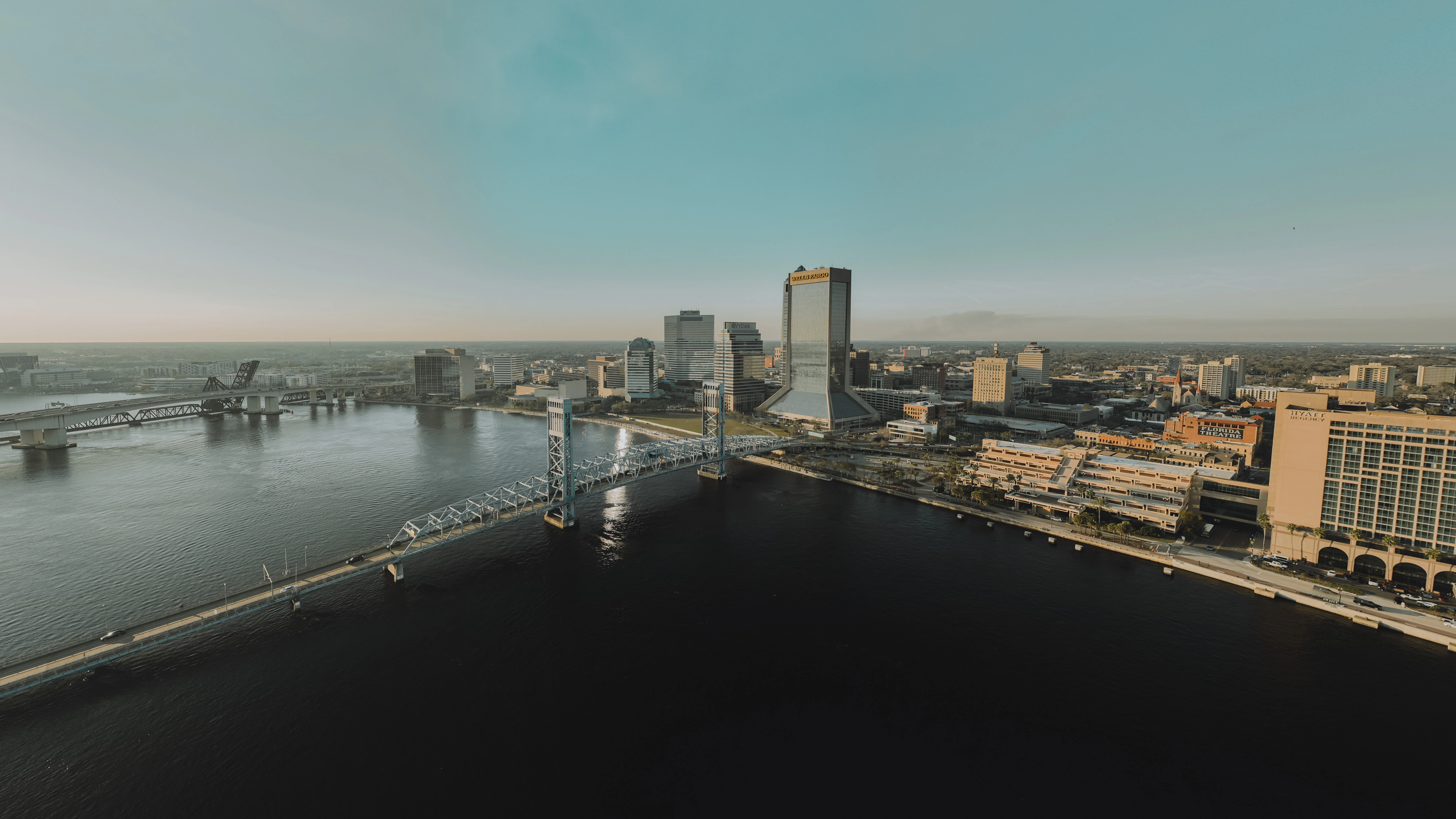 an aerial view of a city and a river