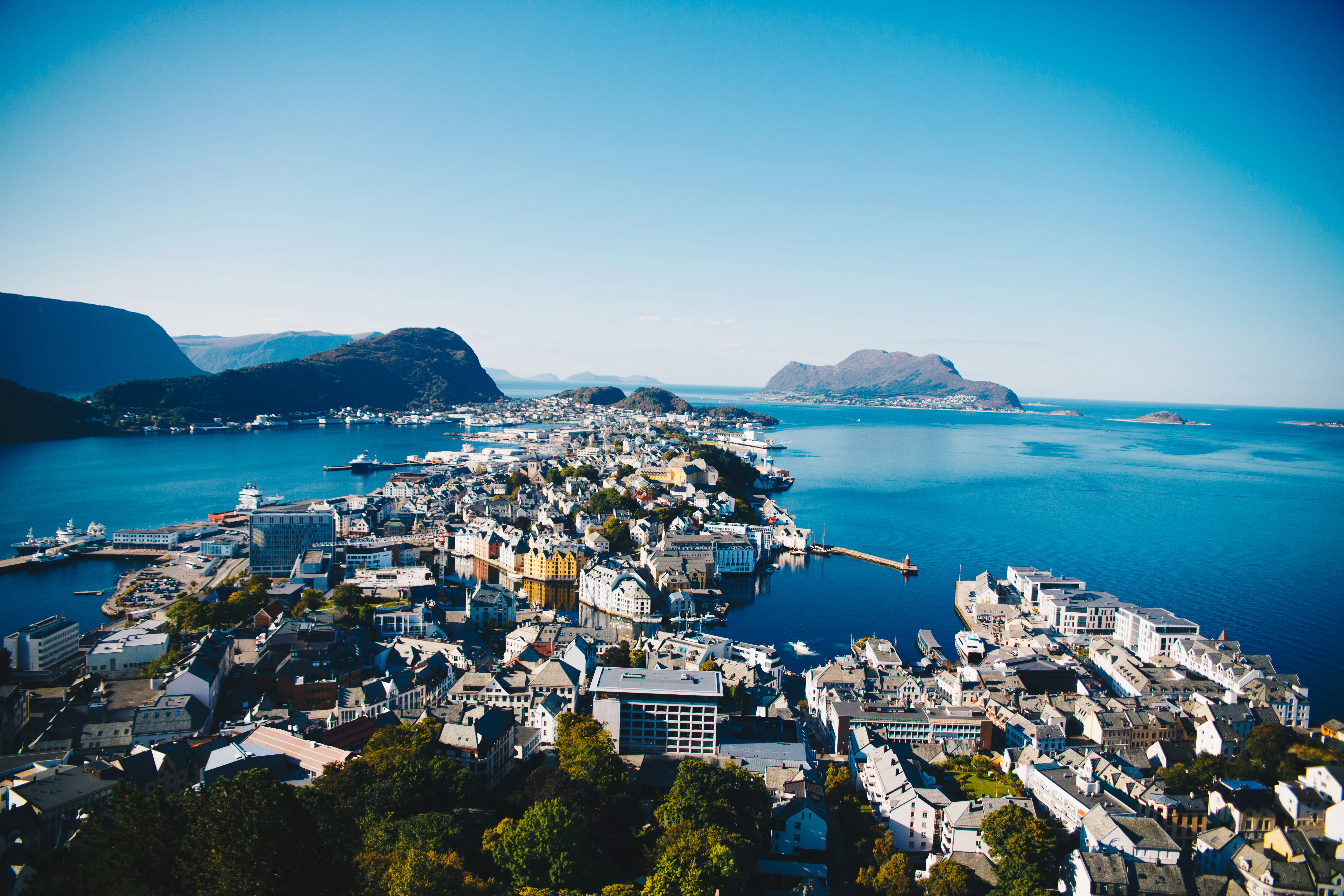 aerial photography of city between body of water