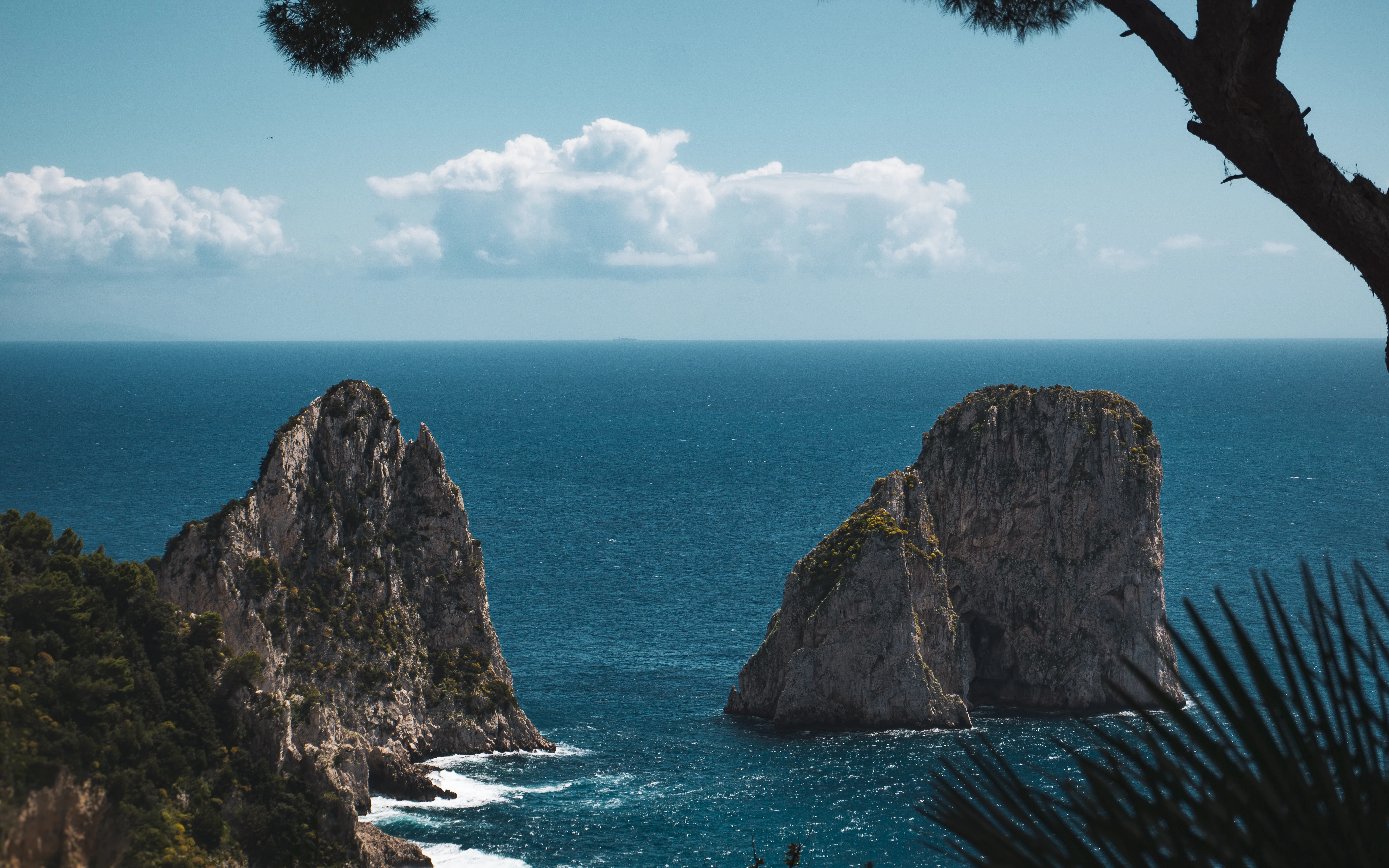 Ocean view with rock formations on a sunny day.