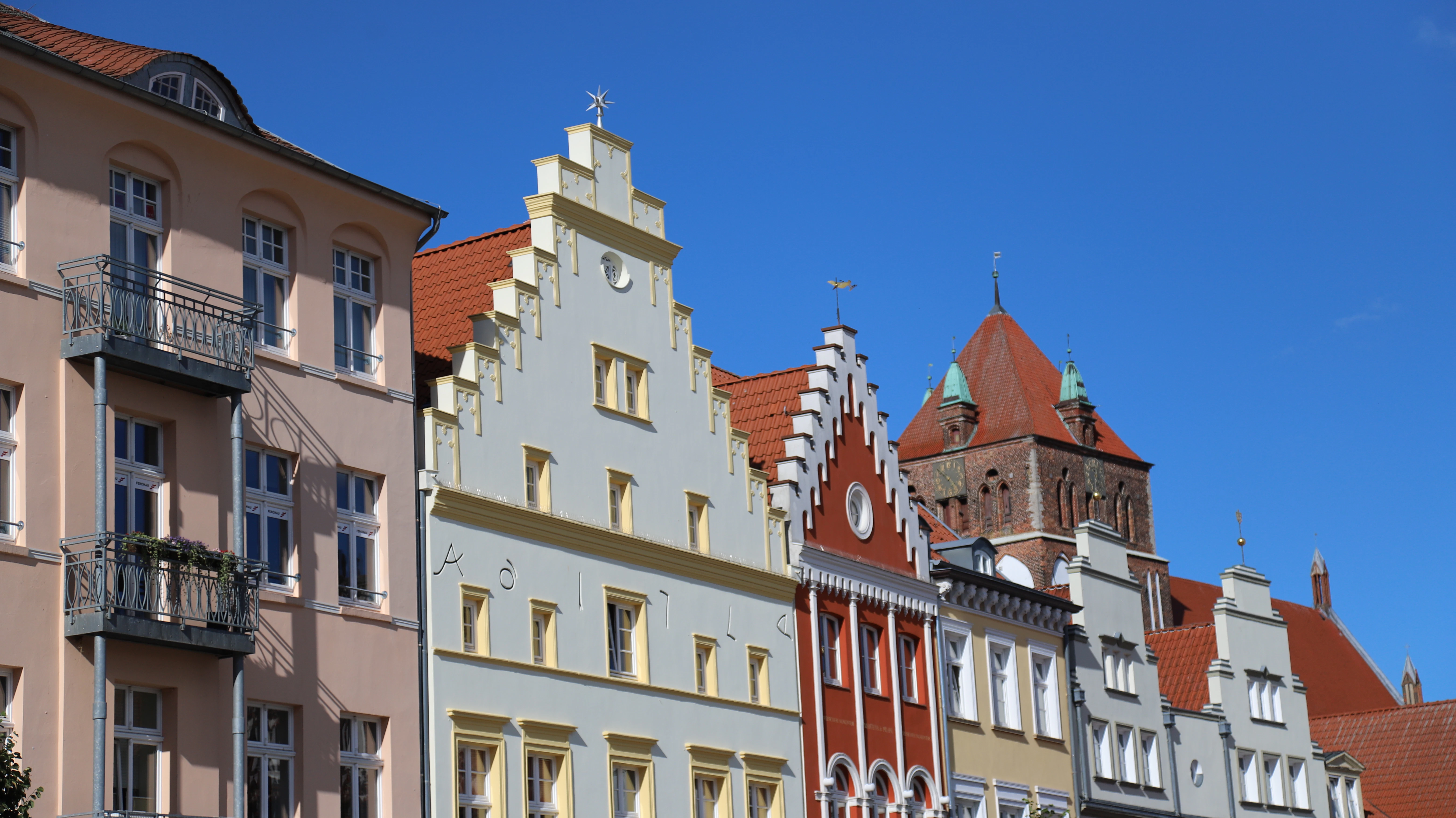 Row of colorful historic buildings under blue sky