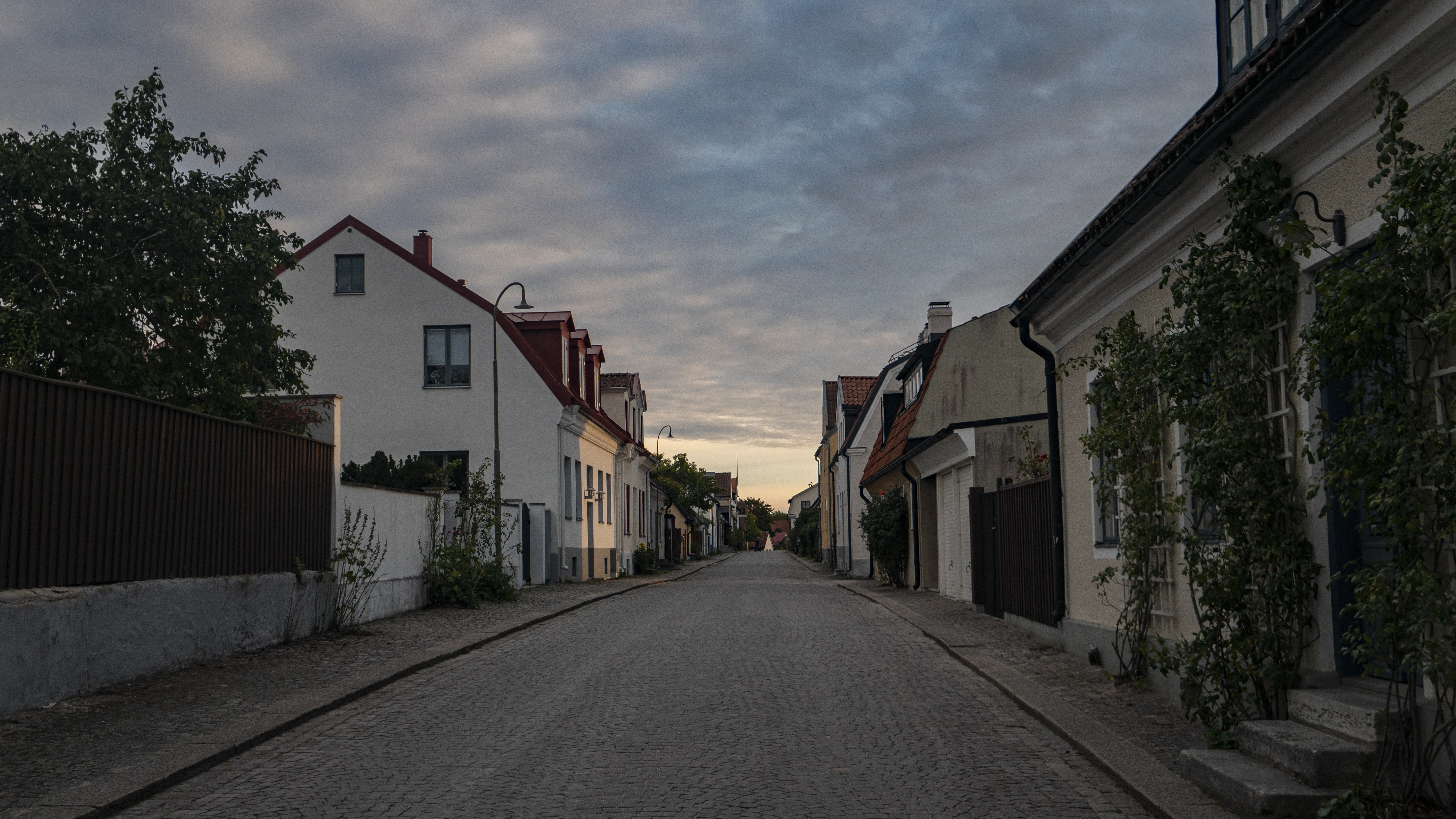a street with a few buildings on both sides of it