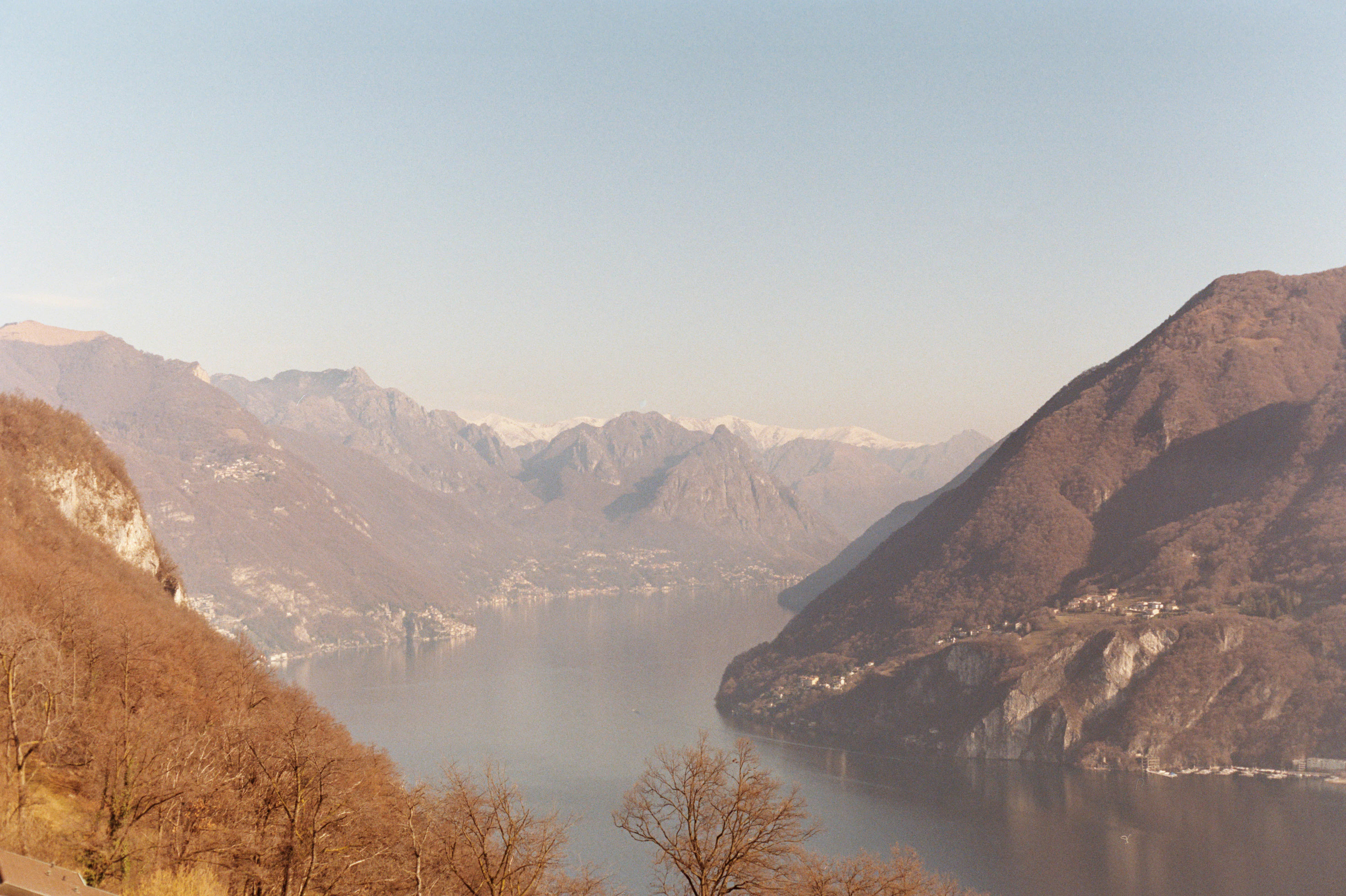 a scenic view of a lake and mountains