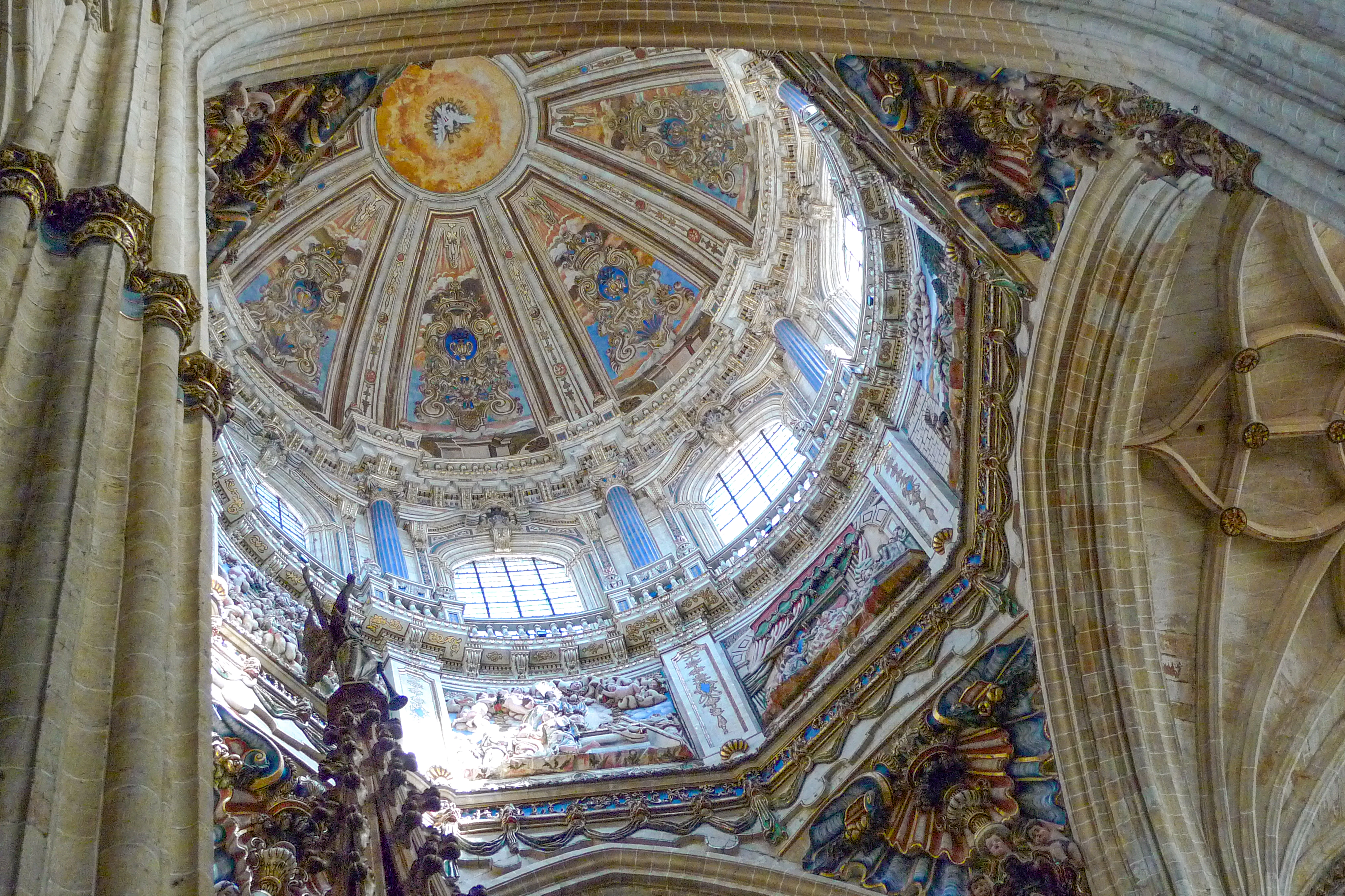 The ceiling of a large cathedral with a dome