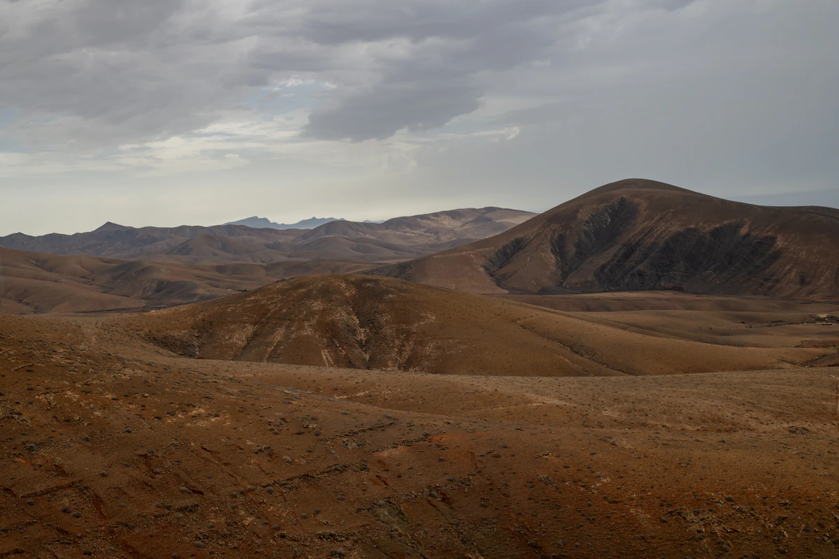 A view of a mountain range from a distance