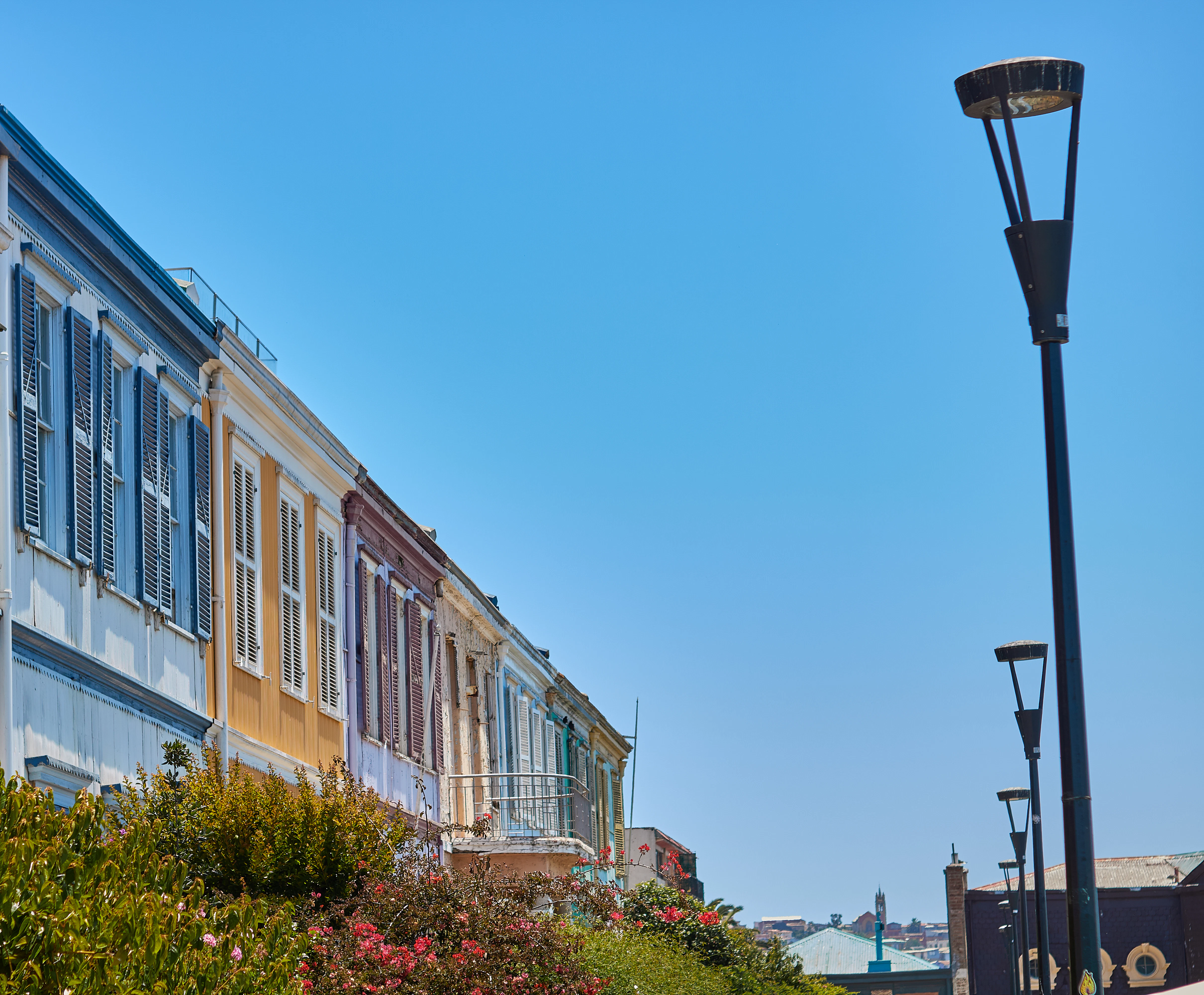 a street light next to a row of buildings