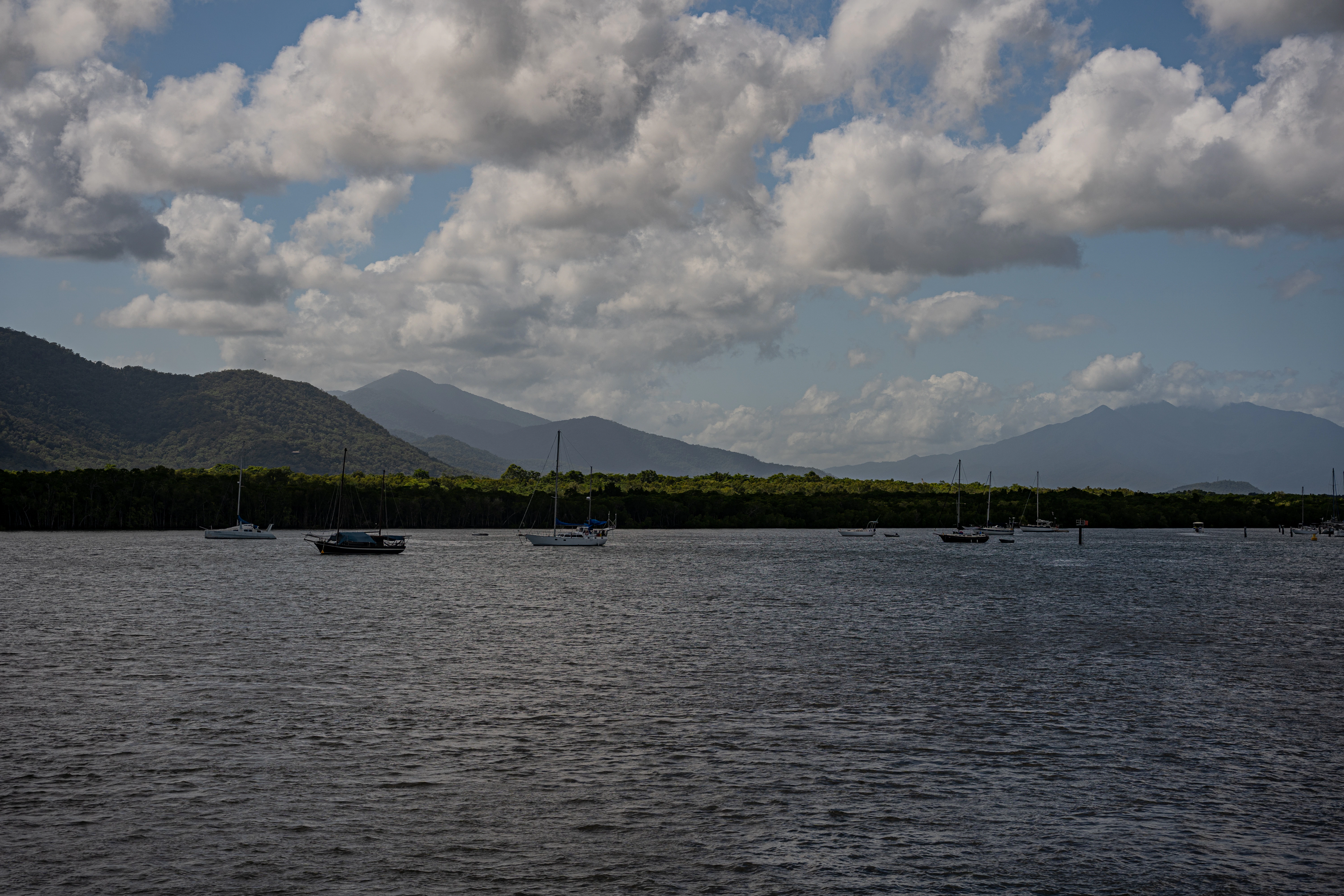 a body of water with boats floating on it