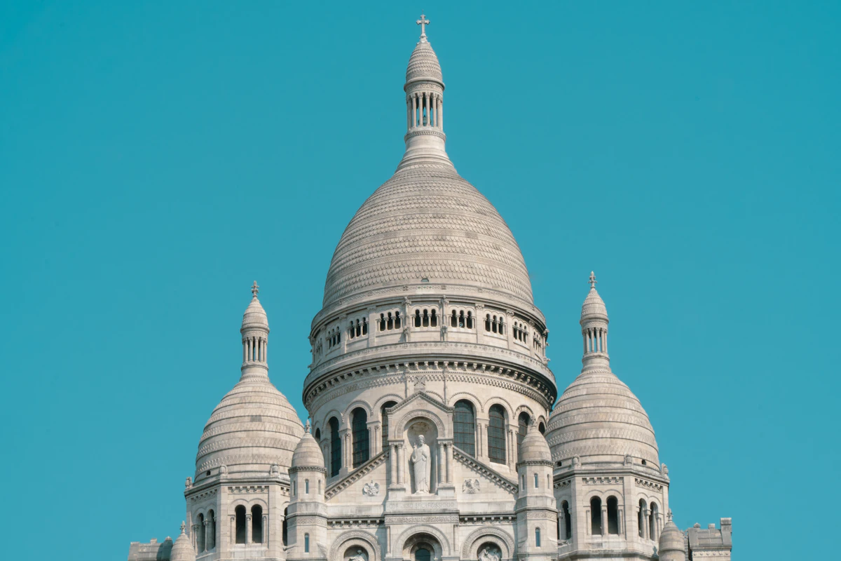 White domed basilica against a clear blue sky