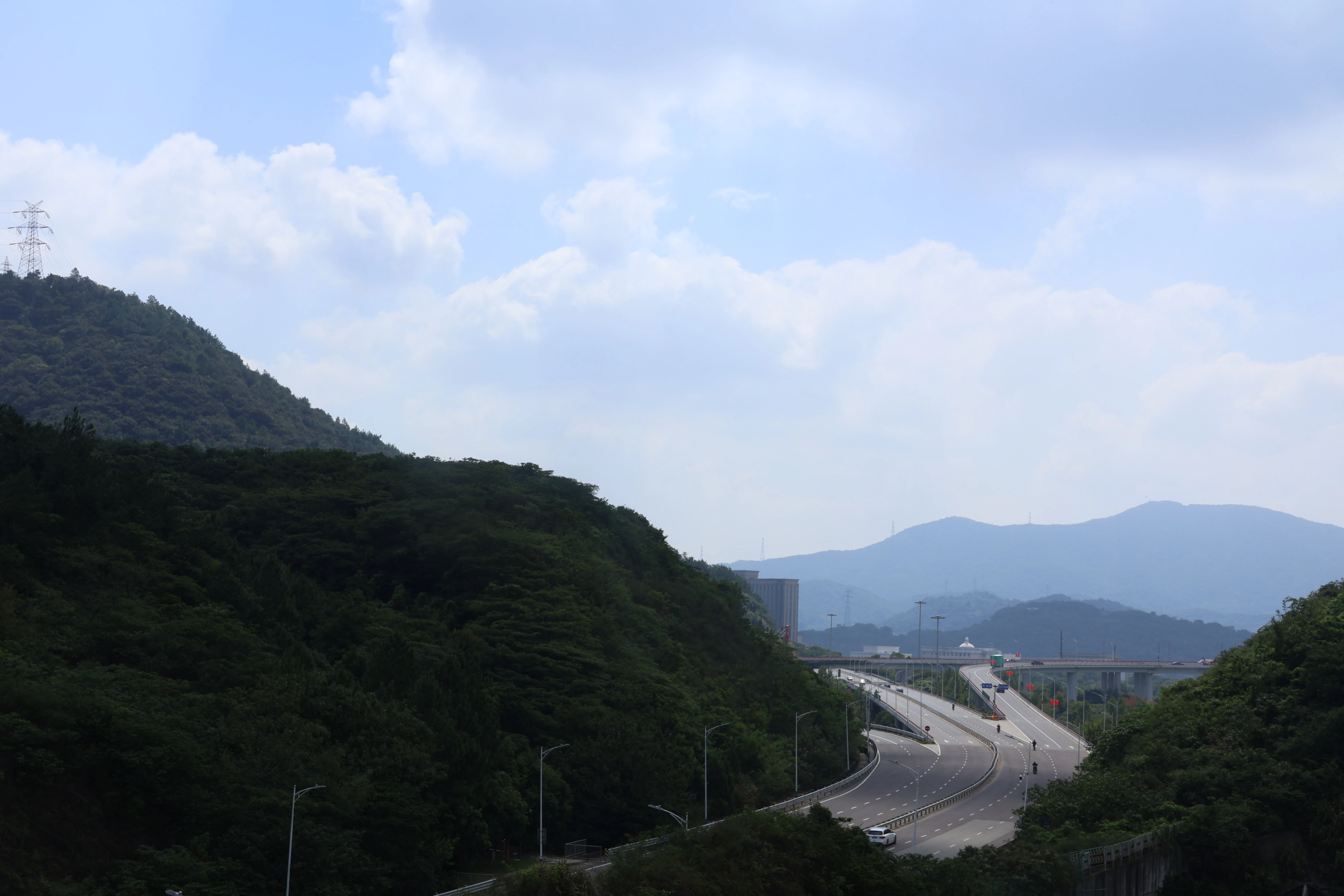 A view of a road in the middle of the mountains