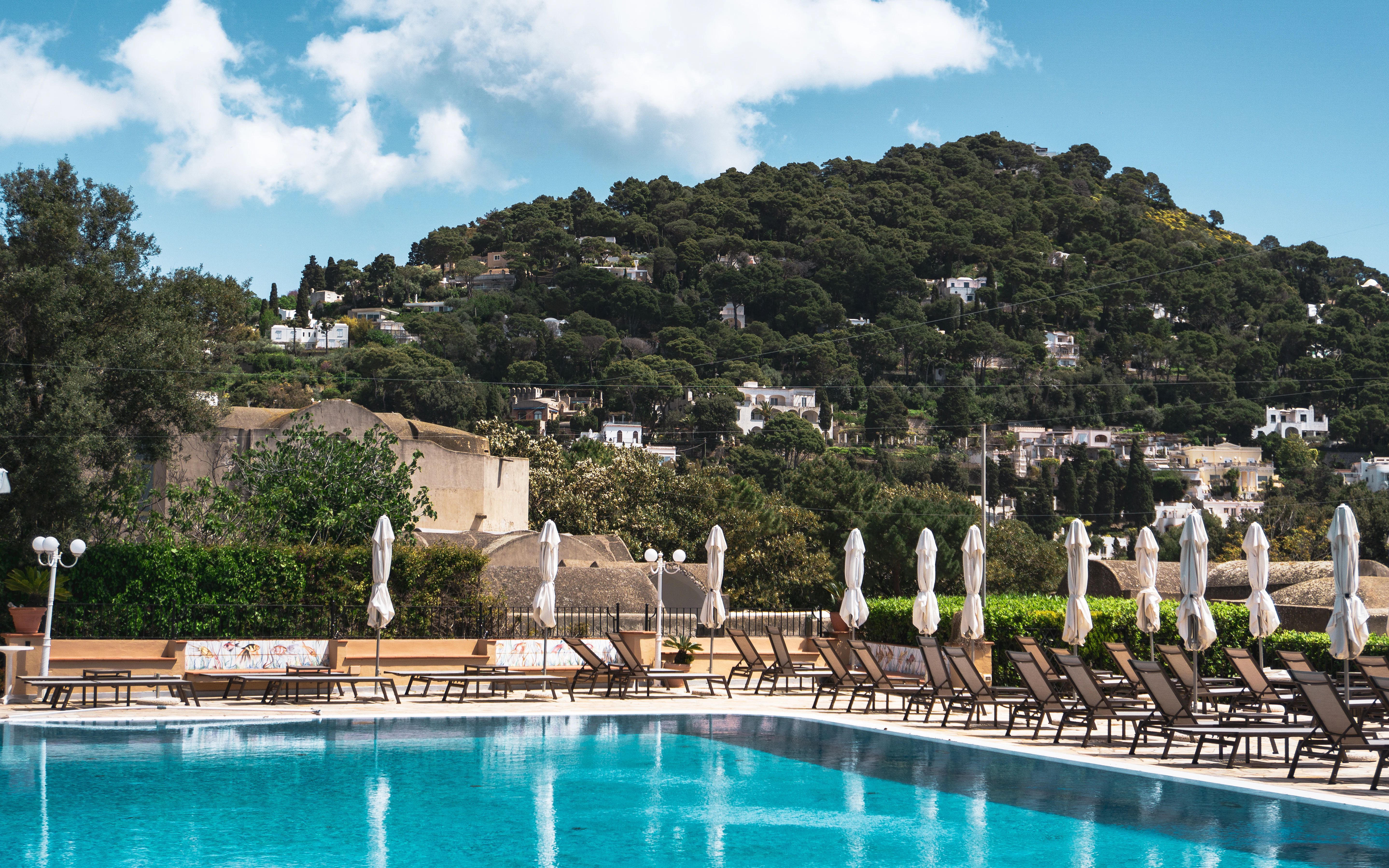 Poolside with a beautiful mountain view.